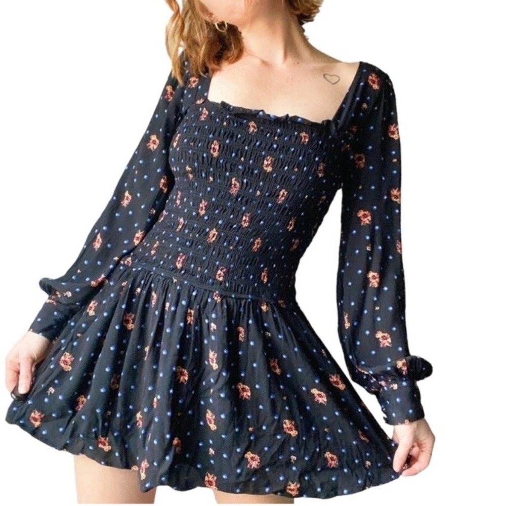Free people two faces printed mini dress size M black floral smocked.
